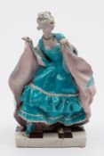 A Chelsea Cheyne pottery theatrical figure modelled by Gwendoline Parnell: the dancing lady wearing
