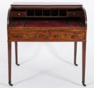 An early 19th Century mahogany cylinder tambour fronted writing desk:,