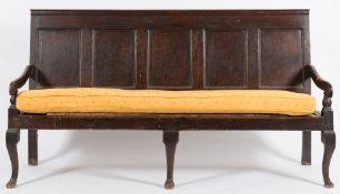 An 18th Century oak rectangular settle:, with a moulded panel back,