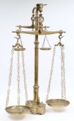 A set of Continental brass floor standing butcher's shop weighing scales:,