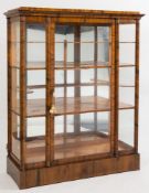 A 19th Century walnut display cabinet in the Art Deco Manner:,