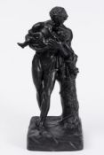 A Wedgwood black basalt figure of the Faun and Bacchus: the standing figure leaning on a tree stump