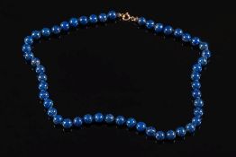 A lapis lazuli bead single string necklace: comprising 50 beads, each approximately 8mm diameter,