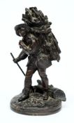 A 19th century bronze figural inkwell:, modelled as a faggot gatherer,