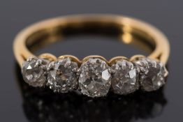 An 18ct gold and diamond five-stone ring: with graduated,