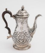 A George III silver coffee pot, maker John Scofield, London, 1773:, initialed, of baluster form,