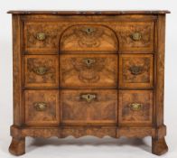 A walnut block front chest in the 18th Century Continental manner:,