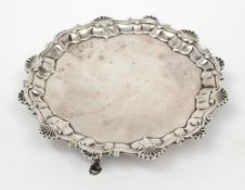 A George III silver card tray, maker Ebenezer Coker, London, 1760:, of circular outline,