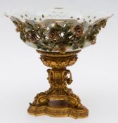A Continental porcelain and gilt metal mounted centrepiece: the pierced cartouche shaped basket
