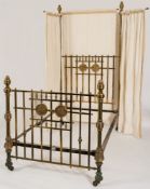 A late Victorian/Edwardian brass half tester bed:,