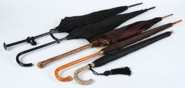 Four parasols and an umbrella: (5)