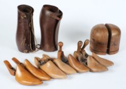 Various wooden shoe trees, a wooden hat stand and two pairs of leather gaiters:.