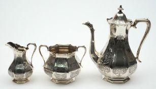 A Victorian silver three-piece coffee set of panelled baluster form:,