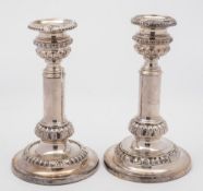 A pair of late 19th Century silver plated telescopic candlesticks:, with urn shaped nozzles,