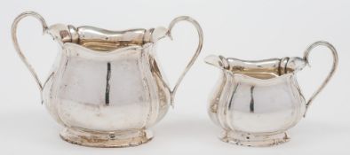 A George V silver sugar bowl and cream jug, maker Henry Atkin, Sheffield,