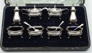 A George V eight piece silver condiment set, maker Edward Barnsley, Birmingham,