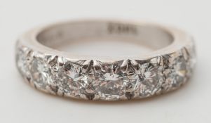 A diamond seven stone half hoop ring:, pave set with circular,