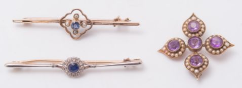 An amethyst and seed pearl brooch set with five circular amethysts amongst seed pearls,