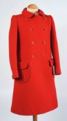 A 'Courreges' red overcoat:.