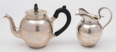 A Dutch silver batchelors teapot and a cream jug, maker A.