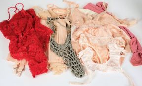 A collection of early 20th century silk stockings, lady's underwear, corsets:, etc.