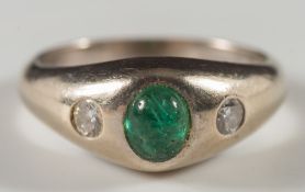 A gypsy-set emerald and diamond three-stone ring:,