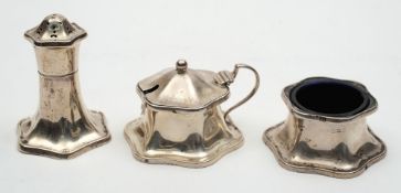 An early 20th century silver three-piece condiment set: of rounded hexagonal form with pepperette,