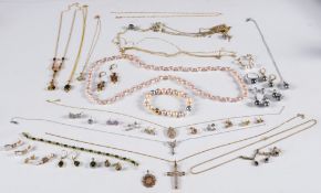 A diamond mounted 'butterfly' pendant on chain, a diamond mounted pendant cross,