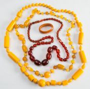 An Art Deco style yellow bead necklace comprising various shaped beads,