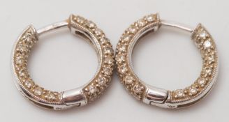 A pair of 18ct white gold and diamond-set hoop earrings:.