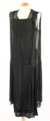 A Victorian black silk and beaded evening dress together with five other various black dresses:.