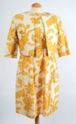 A Christian Dior Modele Original cream and gold two piece suit:.