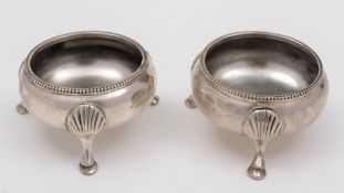 A pair of Victorian silver salts, maker Edward Hutton, London, 1883:, of circular outline,