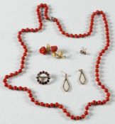 A long coral, single string necklace, a gold and coral mounted spray brooch,