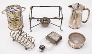A group of plated items: including a syphon stand, a spirit flask, a toast rack,