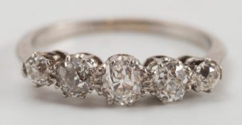A diamond five-stone half-hoop ring: with round old brilliant-cut diamonds, graduated from 0.