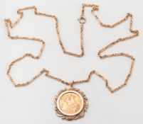 An Elizabeth II sovereign dated '1974' mounted as a pendant: within a gold acorn design frame,