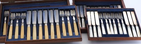 An oak canteen with plated fish knives and forks and a mahogany canteen with dessert knives and