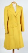 A 'Diorling' yellow overcoat:.