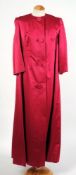 A bright pink silk frock coat together with a similar copper frock coat and a dress:.
