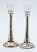 A pair of WMF style candlesticks: with glass nozzles on a slender stem and circular base , 28cm.