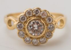 An 18ct yellow gold and diamond circular cluster ring:, the central circular,