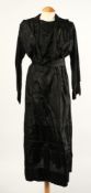 A long black silk dress and seven other various black dresses:.