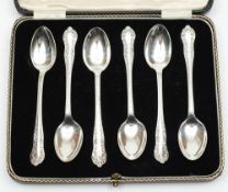 A set of six George V silver teaspoons, maker JR, Sheffield, 1914:, cased. 2.88ozs.