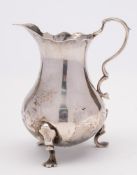 A George II silver cream jug, maker John Muns, London,