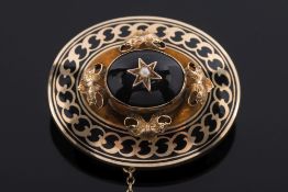 A late 19th century enamelled gold mourning brooch with central oval garnet:.
