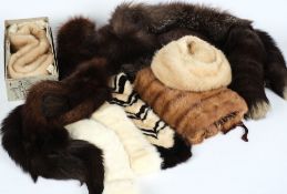A group of fur stoles, hats:, etc.