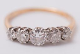 A graduated diamond five stone ring: with old,