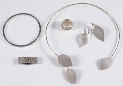 Sylvia Armstrong - a silver torque wire necklace with leaf terminal motifs,