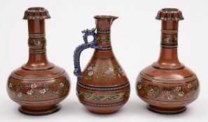 A close pair of Watcombe (Torquay) 'porcelain' vases and a ewer: the former of bottle shaped form